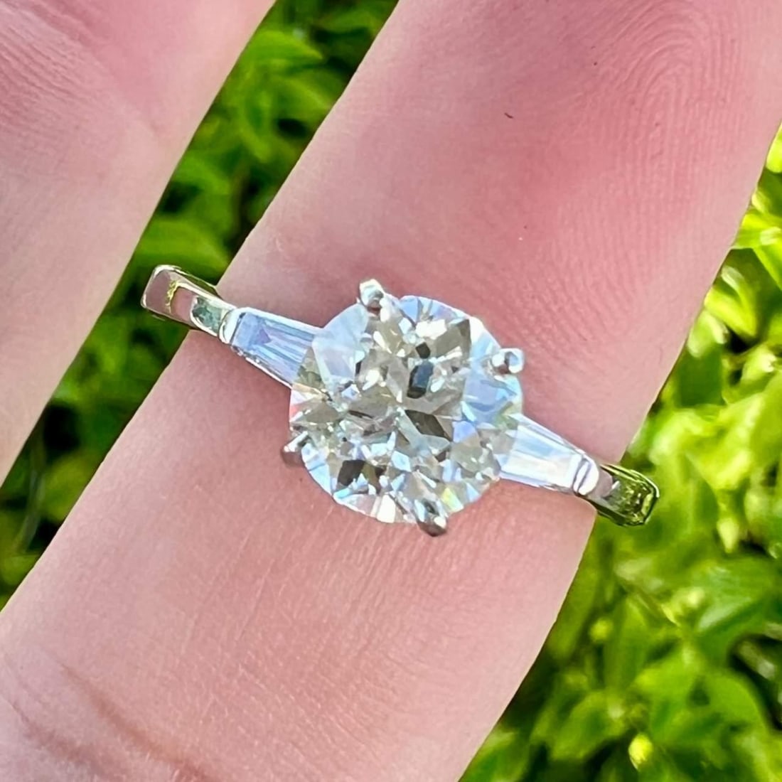 14K White Gold 1.50 Ct. European-Cut Diamond Ring with Baguette Accents: 14K White Gold 1.50 Ct. European-Cut Diamond Ring with Baguette Accents This exquisite 14K White Gold Diamond Ring features a stunning approximately 1.50 Ct. European-cut diamond, showcasing a brillia