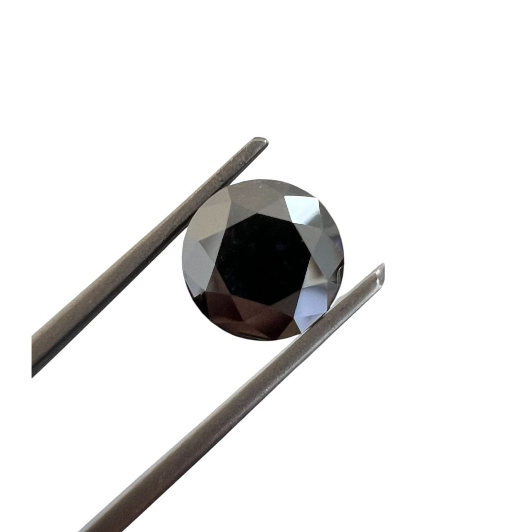 Loose Diamond - ROUND 2.15ct Fancy Black: Loose Diamond - ROUND 2.15ct Fancy Black Source: Natural Shape: ROUND Carats: 2.15 Color: Fancy Black Certification: GIA The Diamond Depot Guarantee: All items in this auction are guaranteed to be 100