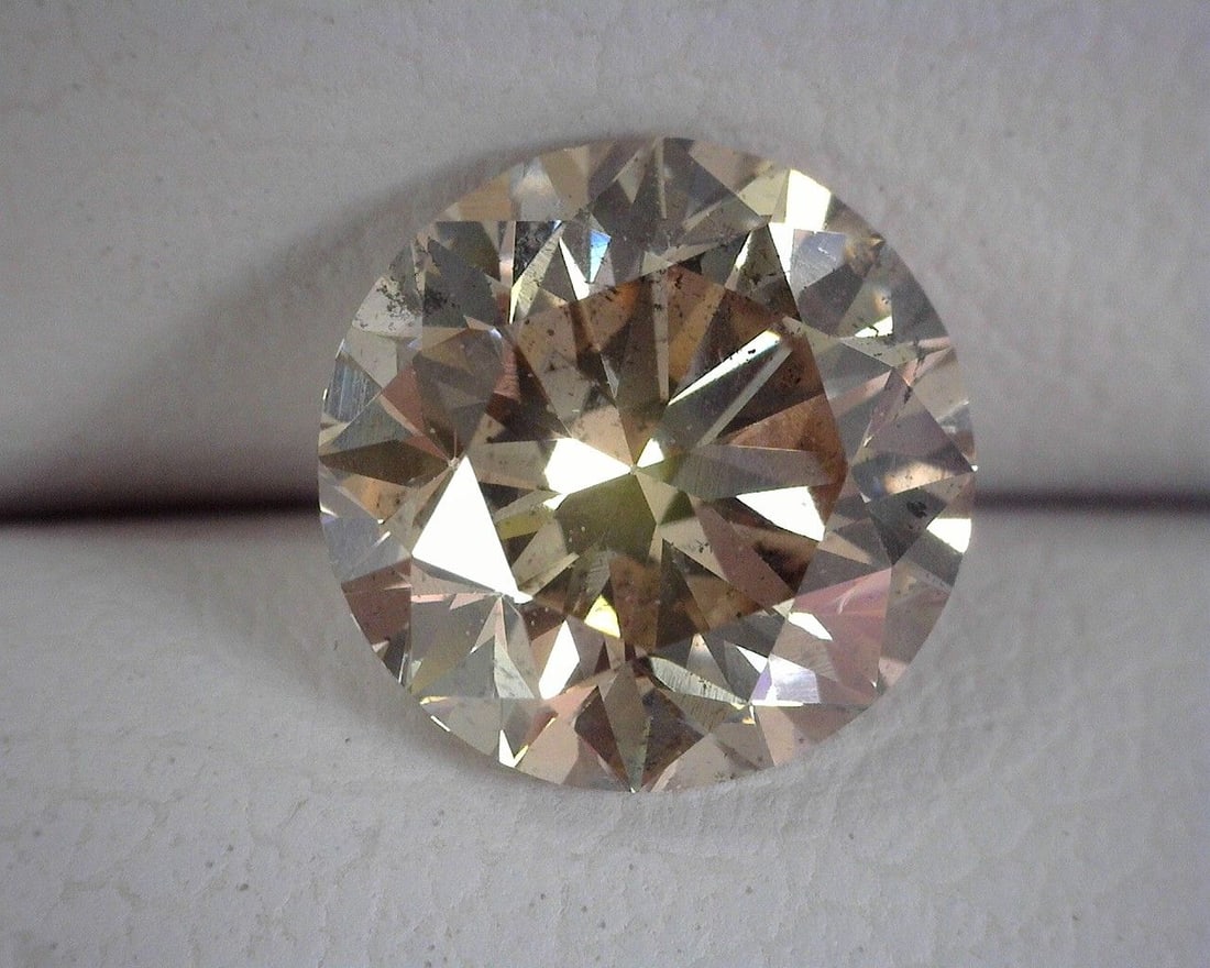 Loose Diamond - ROUND 1.41ct Brown SI2: Loose Diamond - ROUND 1.41ct Brown SI2 Source: Natural Shape: ROUND Carats: 1.41 Color: Brown Certification: OTHER The Diamond Depot Guarantee: All items in this auction are guaranteed to be 100%
