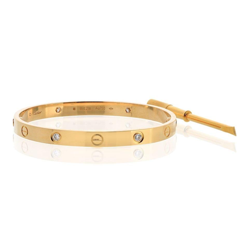Cartier Love Bracelet 18K Yellow Gold Size 18 with 4 Diamonds: Cartier Love Bracelet 18K Yellow Gold Size 18 with 4 Diamonds This Cartier Love bracelet is crafted from 18K yellow gold, weighing 33.4 grams and sized at 18. It features four brilliant round-cut diam