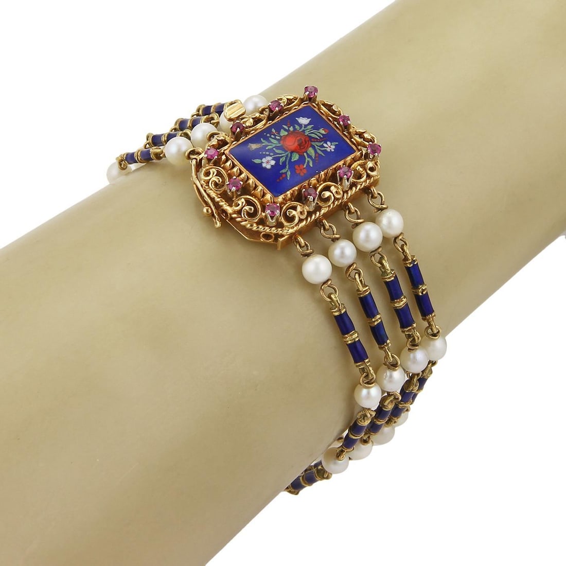 Vintage 18k Yellow Gold Floral Bracelet with Ruby and Pearls: Vintage 18k Yellow Gold Floral Bracelet with Ruby and Pearls This exquisite vintage bracelet is crafted from 18k yellow gold and features a stunning design with four strands of long blue enamel bar li