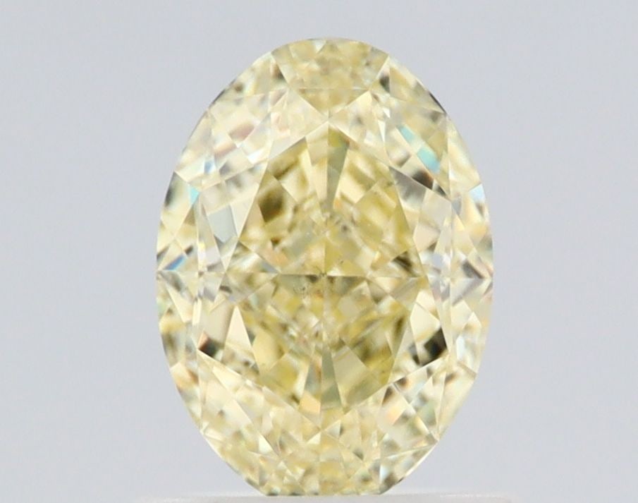 Loose Diamond - OVAL 1.03ct Fancy Light Yellow VS2: Loose Diamond - OVAL 1.03ct Fancy Light Yellow VS2 Source: Natural Shape: OVAL Carats: 1.03 Color: Fancy Light Yellow Certification: GIA Video: