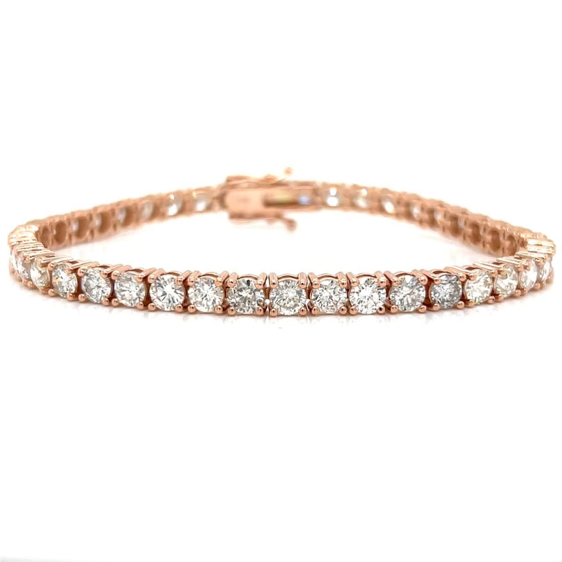 14K Rose Gold 9.40 Ct Diamond Tennis Bracelet 42 Diamonds I-J SI1-SI3: 14K Rose Gold 9.40 Ct Diamond Tennis Bracelet 42 Diamonds I-J SI1-SI3 This exquisite 14K rose gold tennis bracelet features a stunning arrangement of 42 diamonds, totaling approximately 9.40 carats. T