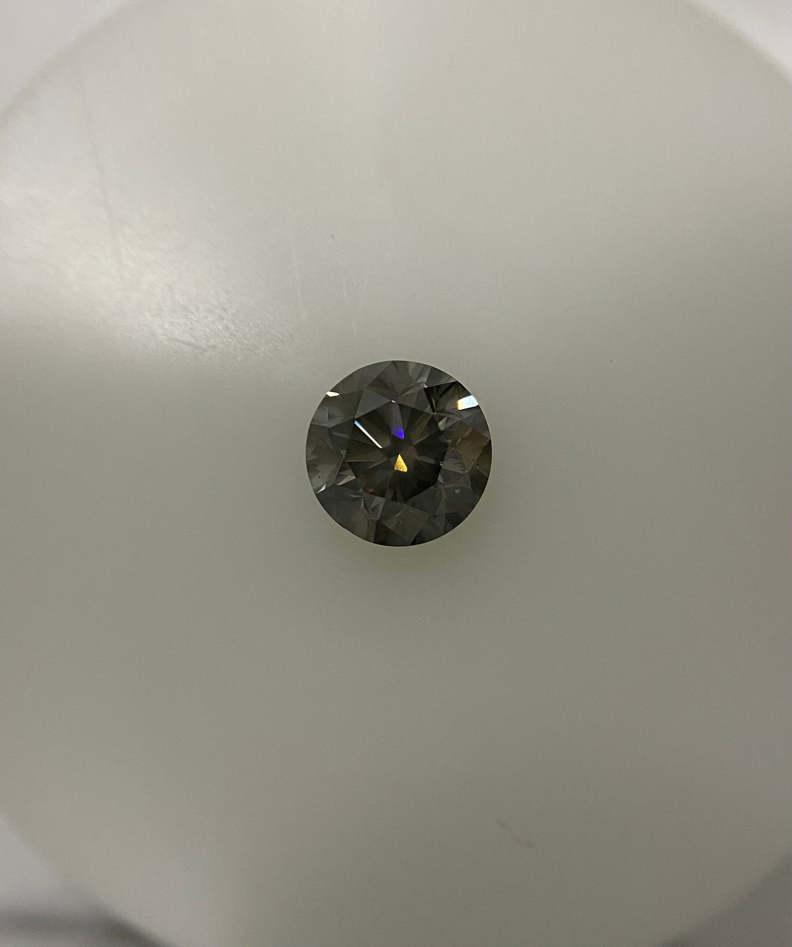 Loose Diamond - ROUND 1.07ct Fancy Gray I1: Loose Diamond - ROUND 1.07ct Fancy Gray I1 Source: Natural Shape: ROUND Carats: 1.07 Color: Fancy Gray Certification: GIA The Diamond Depot Guarantee: All items in this auction are guaranteed to be 10