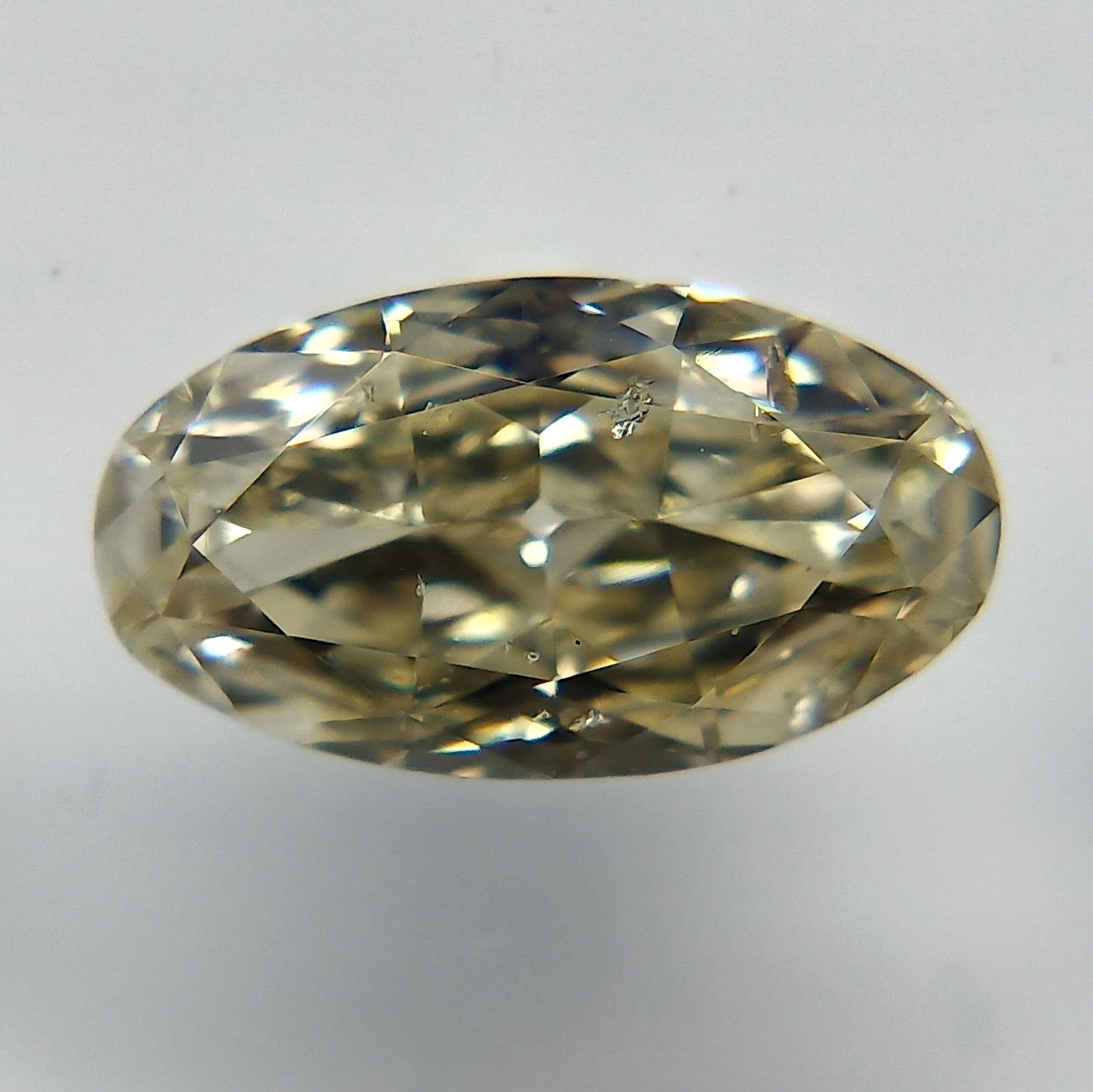 Loose Diamond - OVAL 0.58ct Fancy Light Brownish Yellow: Loose Diamond - OVAL 0.58ct Fancy Light Brownish Yellow Source: Natural Shape: OVAL Carats: 0.58 Color: Fancy Light Brownish Yellow Certification: GIA The Diamond Depot Guarantee: All items in this au