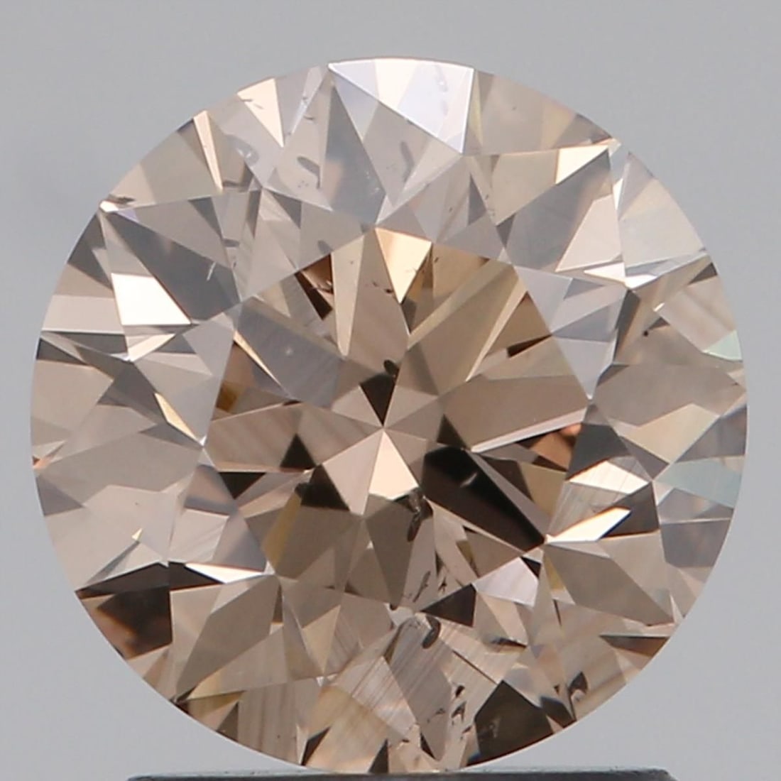 Loose Diamond - ROUND 1.55ct Fancy Brown SI1: Loose Diamond - ROUND 1.55ct Fancy Brown SI1 Source: Natural Shape: ROUND Carats: 1.55 Color: Fancy Brown Certification: NONE Video: