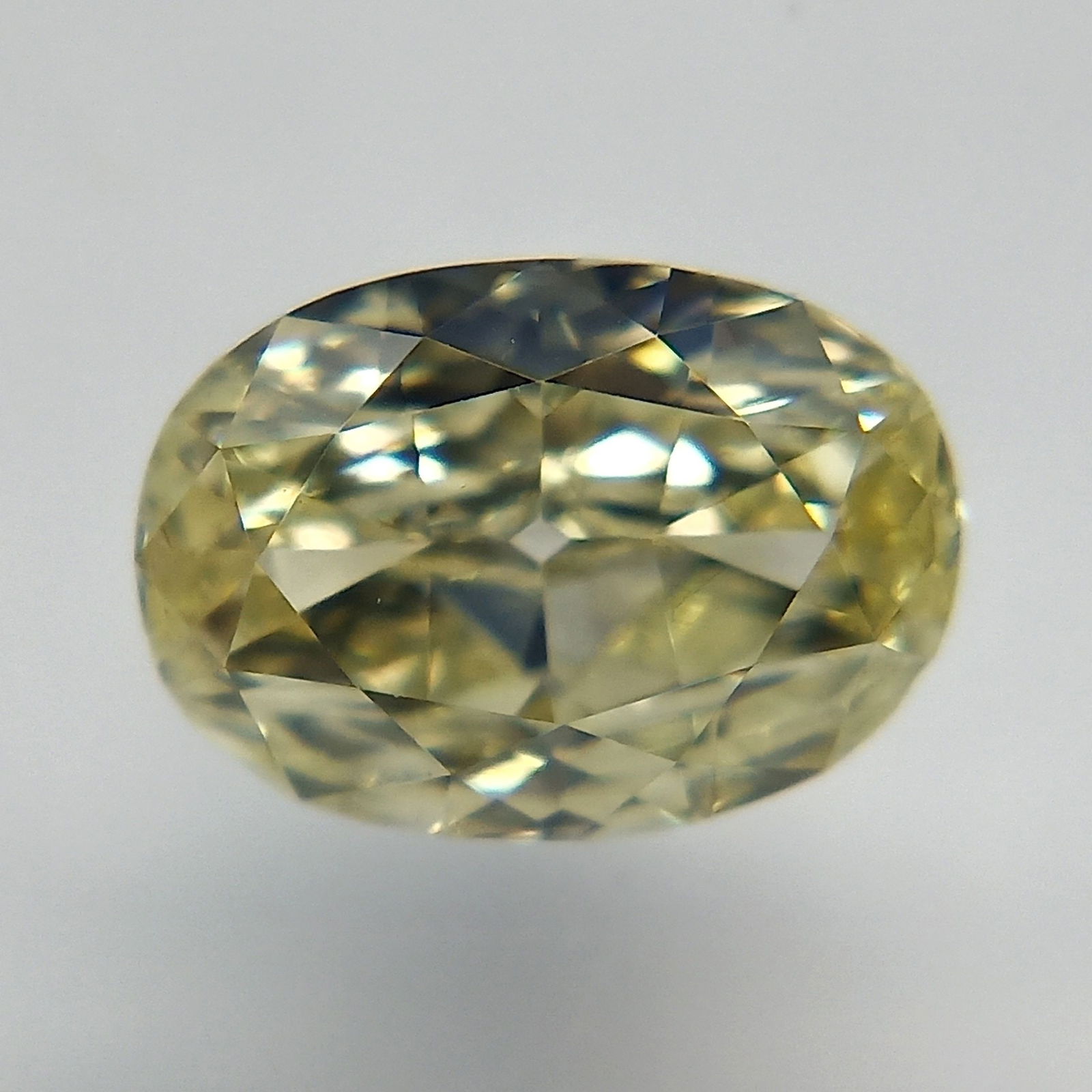 Loose Diamond - OVAL 0.52ct Fancy Light Yellow VS1: Loose Diamond - OVAL 0.52ct Fancy Light Yellow VS1 Source: Natural Shape: OVAL Carats: 0.52 Color: Fancy Light Yellow Certification: GIA The Diamond Depot Guarantee: All items in this auction are guar