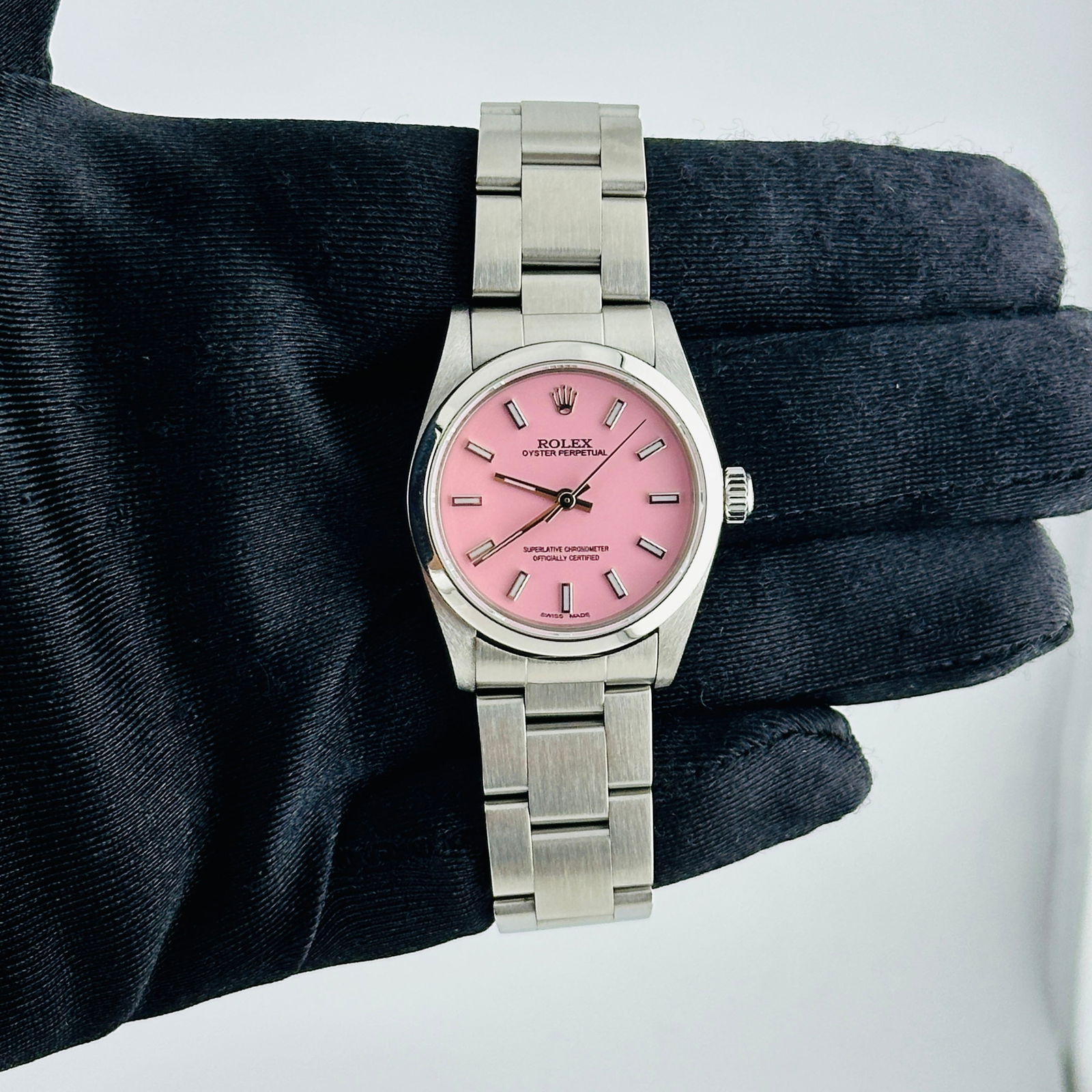 Ladies Rolex Oyster Perpetual Ref 67480 with Aftermarket Pink Stick Dial: Ladies Rolex Oyster Perpetual Ref 67480 with Aftermarket Pink Stick Dial This ladies Rolex Oyster Perpetual features an aftermarket pink stick dial and is fitted with a smooth bezel and an Oyster brac