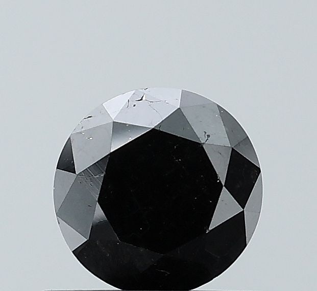 Loose Diamond - ROUND 0.77ct Fancy Black VS2: Loose Diamond - ROUND 0.77ct Fancy Black VS2 Source: Natural Shape: ROUND Carats: 0.77 Color: Fancy Black Certification: NONE Video: