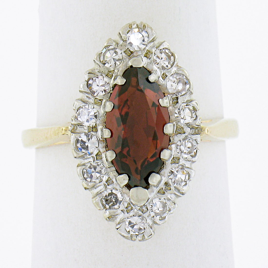 Vintage 14k Gold 1.57ct Marquise Garnet Diamond Halo Cocktail Ring: Vintage 14k Gold 1.57ct Marquise Garnet Diamond Halo Cocktail Ring This exquisite vintage cocktail ring showcases a stunning 1.57ct marquise garnet at its center, surrounded by a halo of 14 old single