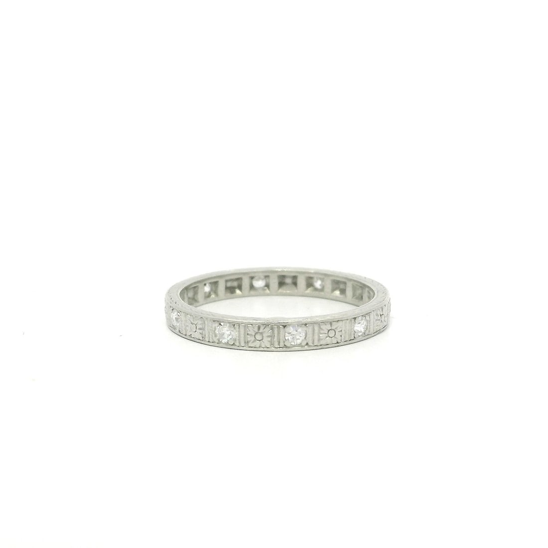 Antique Platinum Floral Diamond Eternity Stack Ring 0.15ct: Antique Platinum Floral Diamond Eternity Stack Ring 0.15ct Discover the timeless elegance of this Antique Platinum Diamond Band, featuring a delicate floral wheat work engraving that enhances its vint