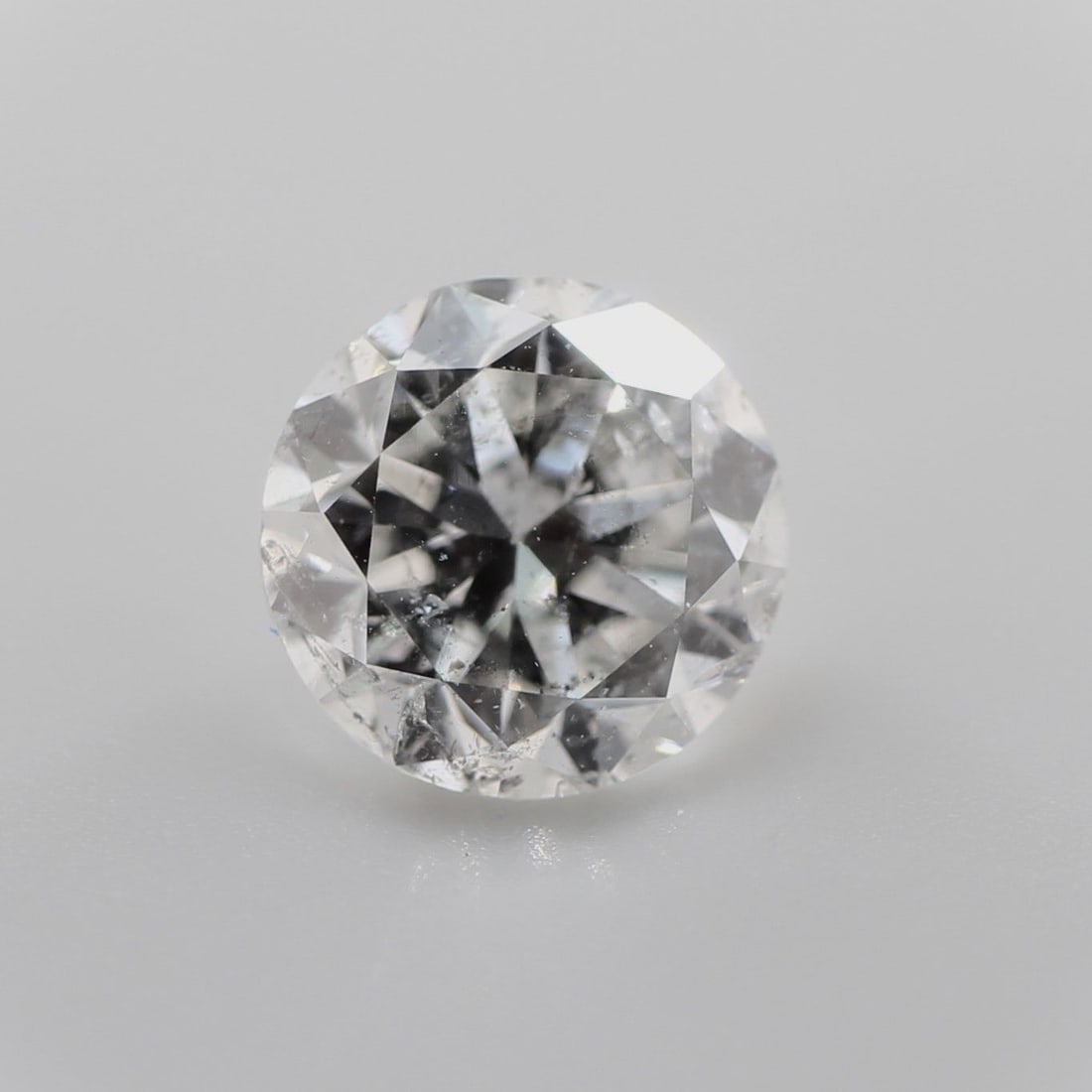 Loose Diamond - ROUND 0.9ct Fancy Gray I1: Loose Diamond - ROUND 0.9ct Fancy Gray I1 Source: Natural Shape: ROUND Carats: 0.9 Color: Fancy Gray Certification: NONE The Diamond Depot Guarantee: All items in this auction are guaranteed to be 100