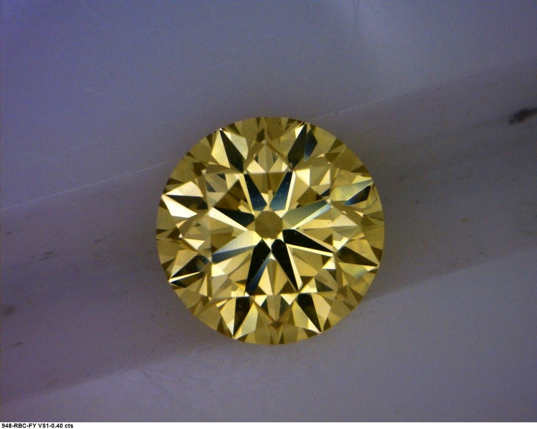 Loose Diamond - ROUND 0.4ct Fancy Yellow: Loose Diamond - ROUND 0.4ct Fancy Yellow Source: Natural Shape: ROUND Carats: 0.4 Color: Fancy Yellow Certification: GIA The Diamond Depot Guarantee: All items in this auction are guaranteed to be 100