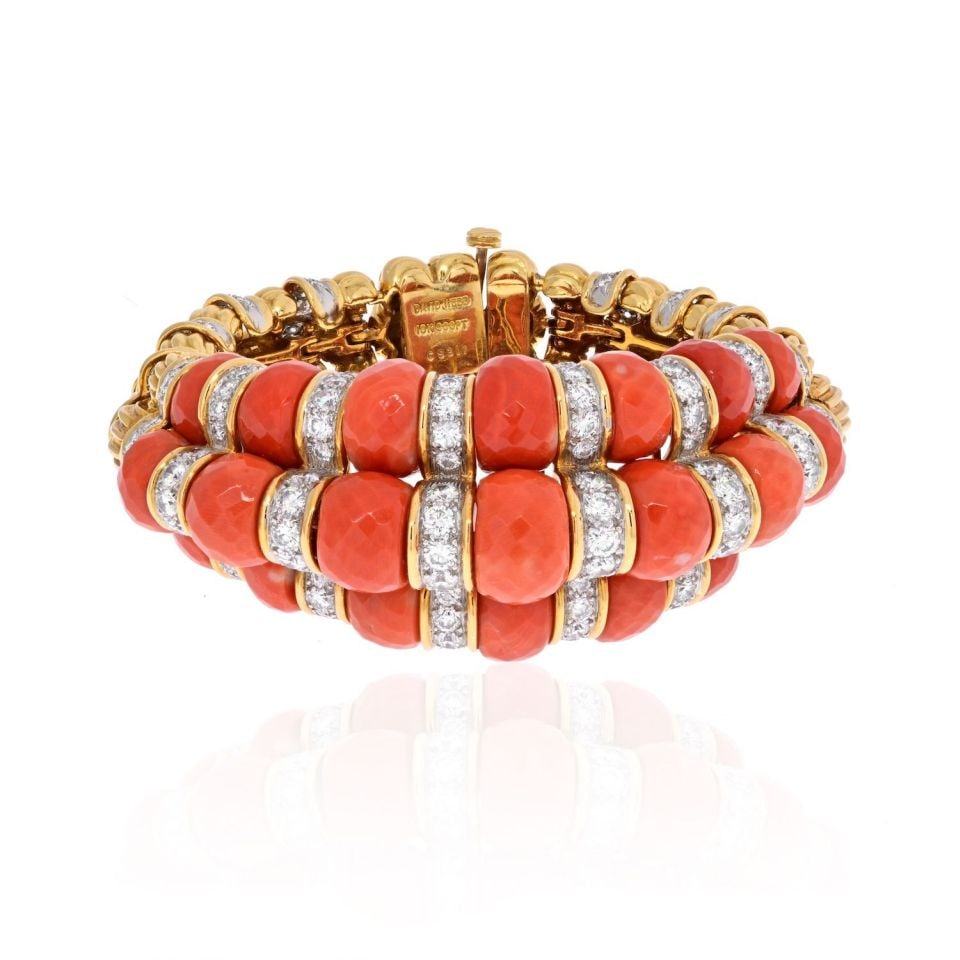 David Webb Platinum 18K Yellow Gold Coral Diamond Bracelet: David Webb Platinum 18K Yellow Gold Coral Diamond Bracelet This stunning bracelet showcases a captivating combination of platinum and 18K yellow gold, adorned with multi-layered faceted coral and