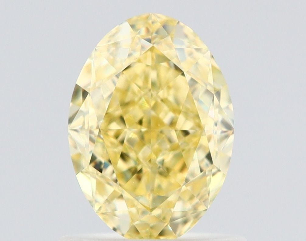 Loose Diamond - OVAL 1.1ct Fancy Yellow VVS2: Loose Diamond - OVAL 1.1ct Fancy Yellow VVS2 Source: Natural Shape: OVAL Carats: 1.1 Color: Fancy Yellow Certification: GIA The Diamond Depot Guarantee: All items in this auction are guaranteed to be