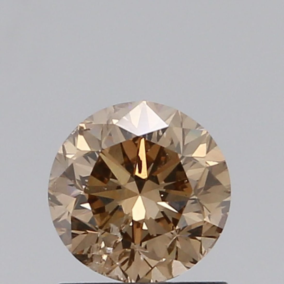 Loose Diamond - ROUND 0.94ct Fancy Brown SI2: Loose Diamond - ROUND 0.94ct Fancy Brown SI2 Source: Natural Shape: ROUND Carats: 0.94 Color: Fancy Brown Certification: NONE Video:
