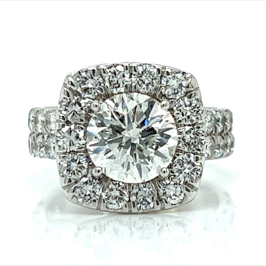 18K White Gold 2.26 Ct Diamond Engagement Ring with 38 Side Diamonds: 18K White Gold 2.26 Ct Diamond Engagement Ring with 38 Side Diamonds This stunning 18K white gold engagement ring features a captivating 2.26 Ct. round brilliant diamond at its center, showcasing H co