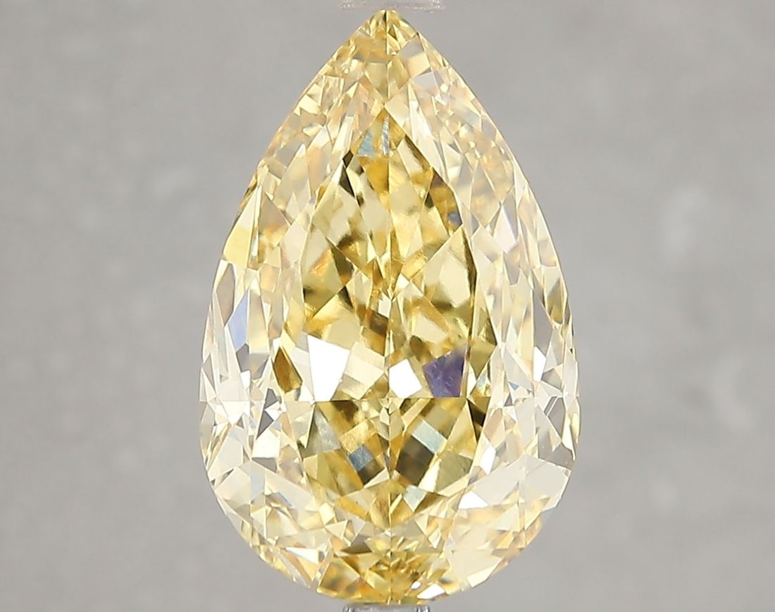 Loose Diamond - PEAR 5.12ct Fancy Vivid Yellow VS1: Loose Diamond - PEAR 5.12ct Fancy Vivid Yellow VS1 Source: This is a real non-mined Diamond that has been grown in a lab Shape: PEAR Carats: 5.12 Color: Fancy Vivid Yellow Certification: IGI Video:
