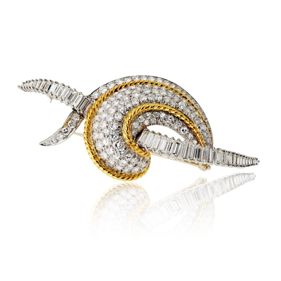 1970s Platinum 18K Yellow Gold 8 Carat Diamond Scroll Brooch: 1970s Platinum 18K Yellow Gold 8 Carat Diamond Scroll Brooch This exquisite brooch, crafted in the 1970s, features a stunning combination of Platinum and 18K Yellow Gold. It showcases approximately 8