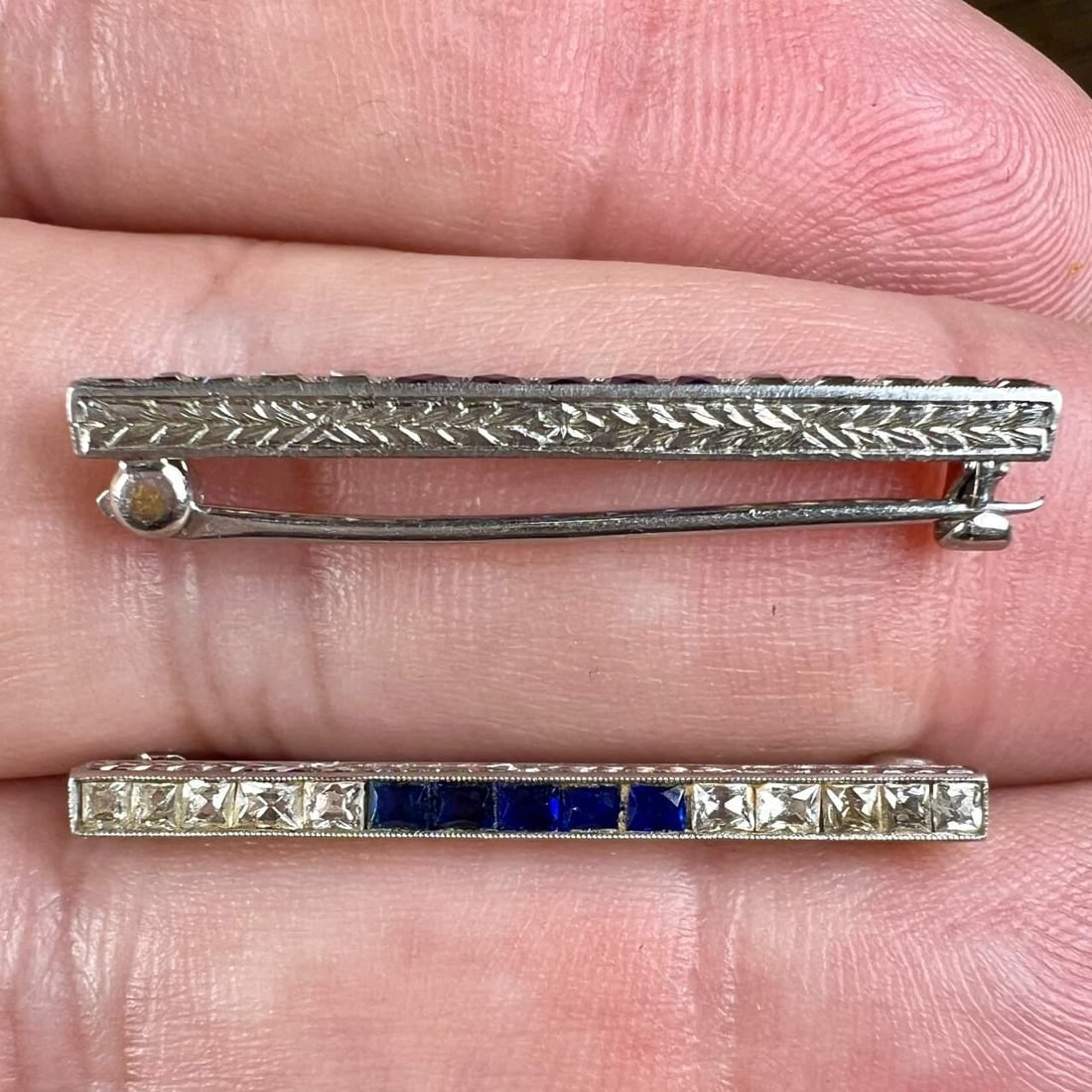 Art Deco Platinum Diamond Sapphire Lingerie Clips 1.25 Inches: Art Deco Platinum Diamond Sapphire Lingerie Clips 1.25 Inches This exquisite pair of Art Deco lingerie clips showcases the elegance of platinum adorned with sparkling diamonds and vibrant sapphires. T