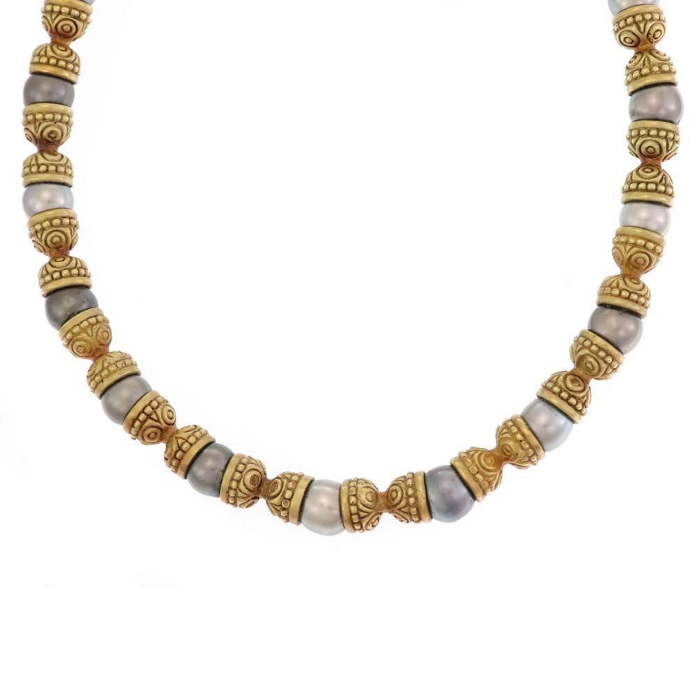 Kanaris 18k Yellow Gold Gray Cultured Pearl Scroll Necklace: Kanaris 18k Yellow Gold Gray Cultured Pearl Scroll Necklace This exquisite necklace by Kanaris showcases a stunning design crafted from 18k yellow gold. It features a series of double-end dome cap lin