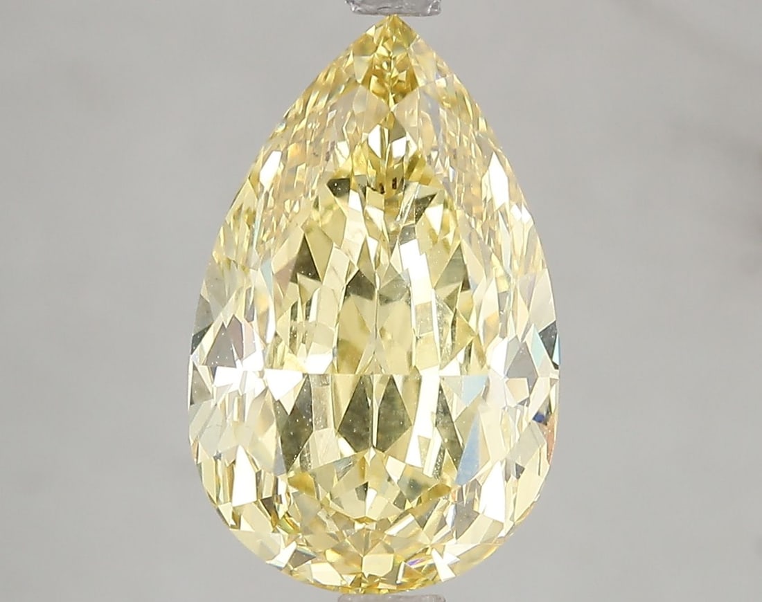 Loose Diamond - PEAR 5.13ct Fancy Vivid Yellow VS2: Loose Diamond - PEAR 5.13ct Fancy Vivid Yellow VS2 Source: This is a real non-mined Diamond that has been grown in a lab Shape: PEAR Carats: 5.13 Color: Fancy Vivid Yellow Certification: IGI Video: