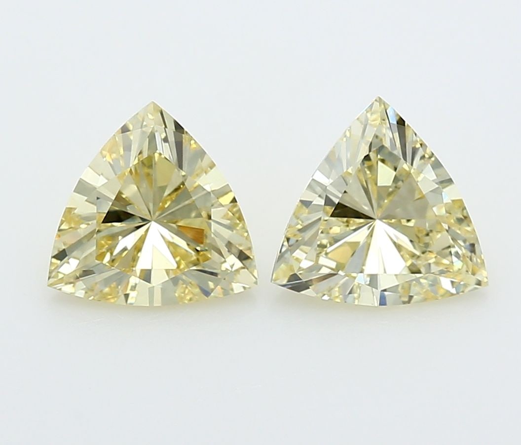 Loose Diamond - TRIANGULAR 2.18ct Yellow VVS2: Loose Diamond - TRIANGULAR 2.18ct Yellow VVS2 Source: This is a real non-mined Diamond that has been grown in a lab Shape: TRIANGULAR Carats: 2.18 Color: Yellow Certification: NONE Video: