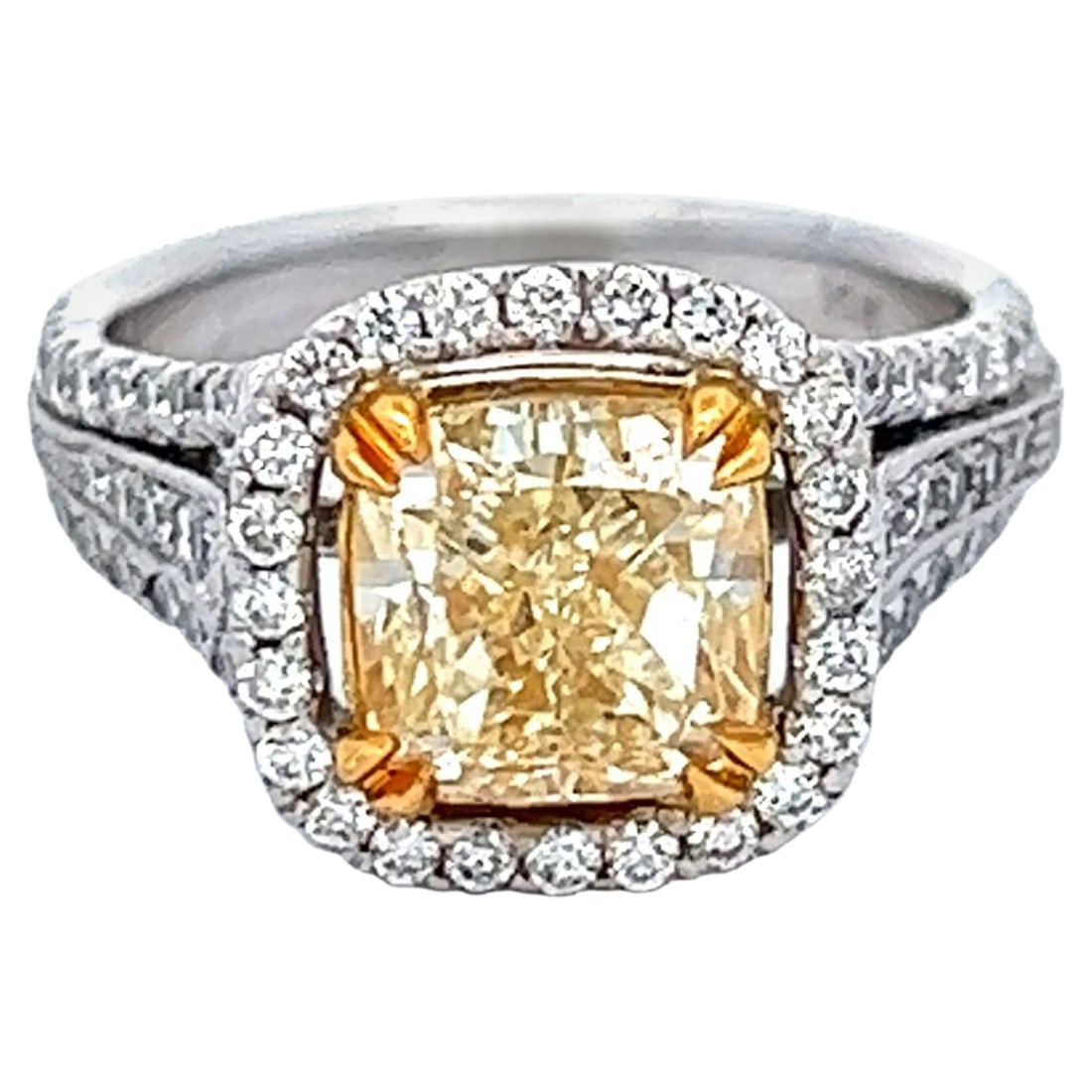 2.58ct Fancy Intense Yellow Diamond Ring 18k Two-Tone EGL Certified: 2.58ct Fancy Intense Yellow Diamond Ring 18k Two-Tone EGL Certified This exquisite ring features a stunning 2.58ct Fancy Intense Yellow cushion cut diamond, graded VS1 for clarity. The diamond is eleg