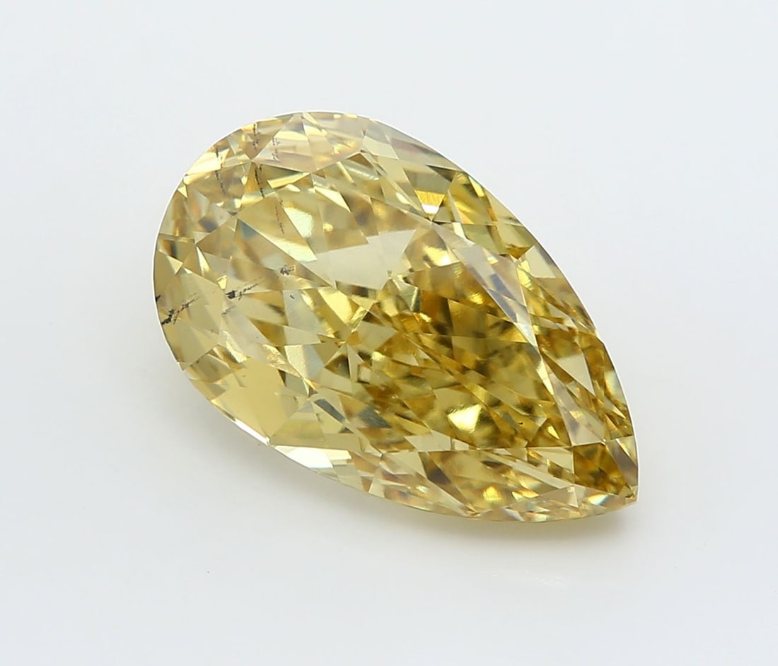 Loose Diamond - PEAR 5.2ct Fancy Vivid Yellow VS2: Loose Diamond - PEAR 5.2ct Fancy Vivid Yellow VS2 Source: This is a real non-mined Diamond that has been grown in a lab Shape: PEAR Carats: 5.2 Color: Fancy Vivid Yellow Certification: IGI Video: