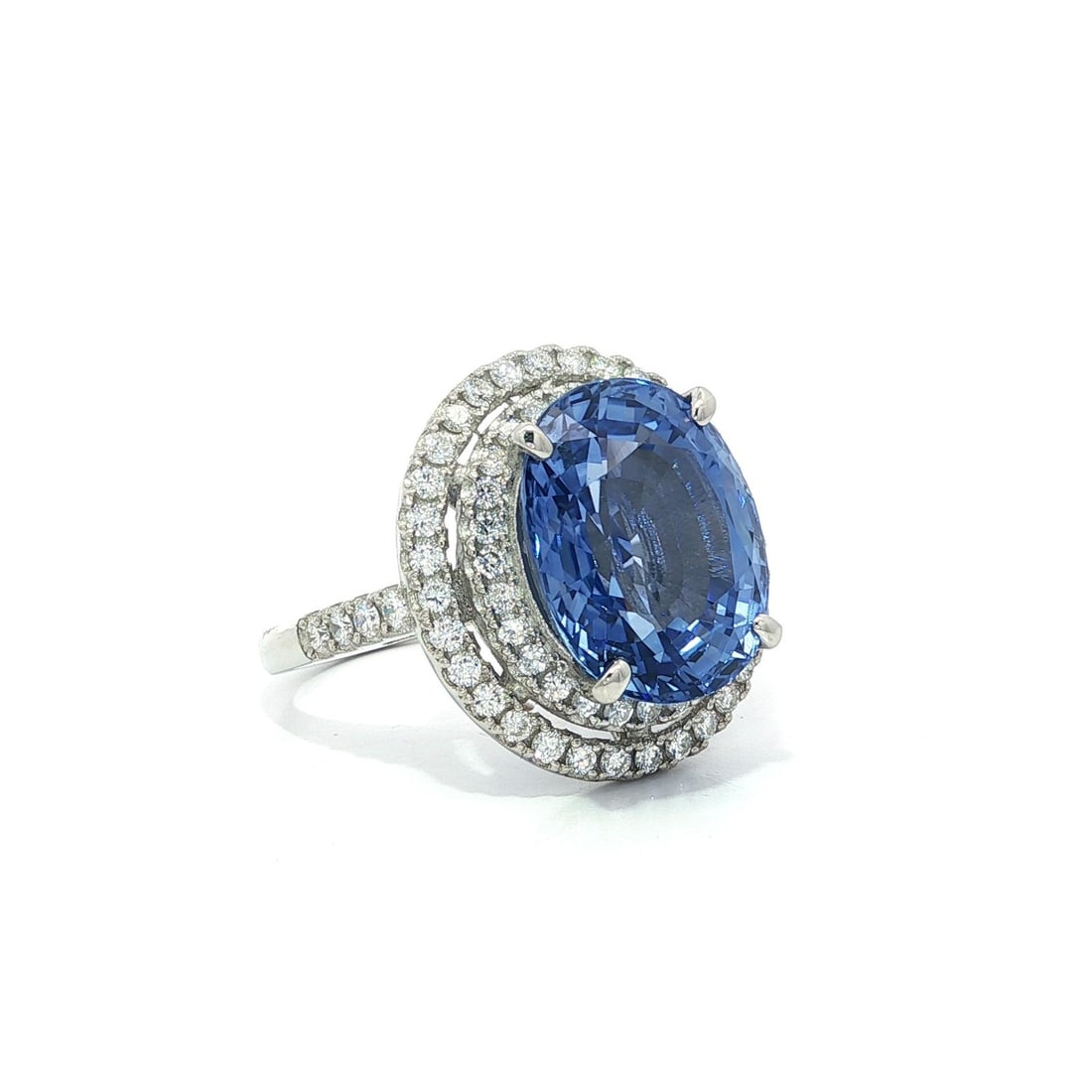 Platinum GIA Certified 10.50ct Ceylon Blue Sapphire Halo Ring: Platinum GIA Certified 10.50ct Ceylon Blue Sapphire Halo Ring This stunning Platinum ring features a large natural Ceylon cornflower blue sapphire, elegantly surrounded by a halo of sparkling diamonds