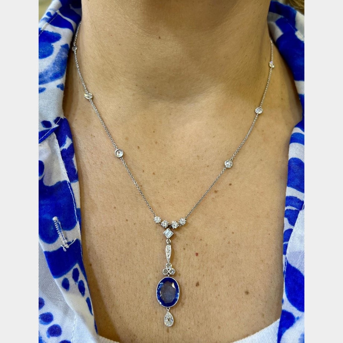 Art Deco Platinum Necklace AGL Certified Ceylon No Heat Sapphire 9 Ct Diamonds: Art Deco Platinum Necklace AGL Certified Ceylon No Heat Sapphire 9 Ct Diamonds This exquisite Art Deco necklace is crafted in platinum and features an AGL Certified Ceylon No Heat Sapphire, weighing
