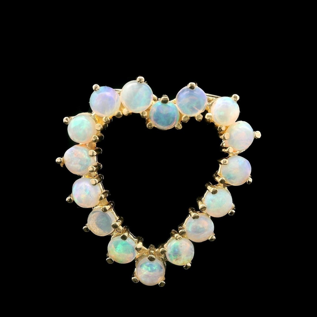 14k Yellow Gold Open Heart Pendant with Round Cabochon Opal: 14k Yellow Gold Open Heart Pendant with Round Cabochon Opal This exquisite open heart slide pendant is crafted from solid 14k yellow gold and features a stunning array of natural genuine opals. The pe
