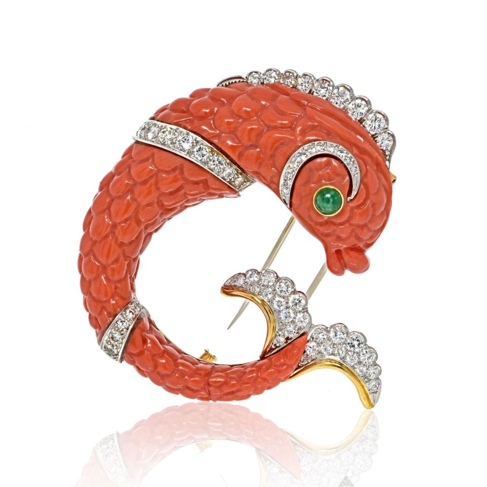 David Webb Platinum Coral Dolphin Brooch with Diamonds 2.70 Cts: David Webb Platinum Coral Dolphin Brooch with Diamonds 2.70 Cts This exquisite David Webb Platinum Carved Coral Dolphin Clip Brooch is a true testament to fine jewelry craftsmanship. The brooch featur
