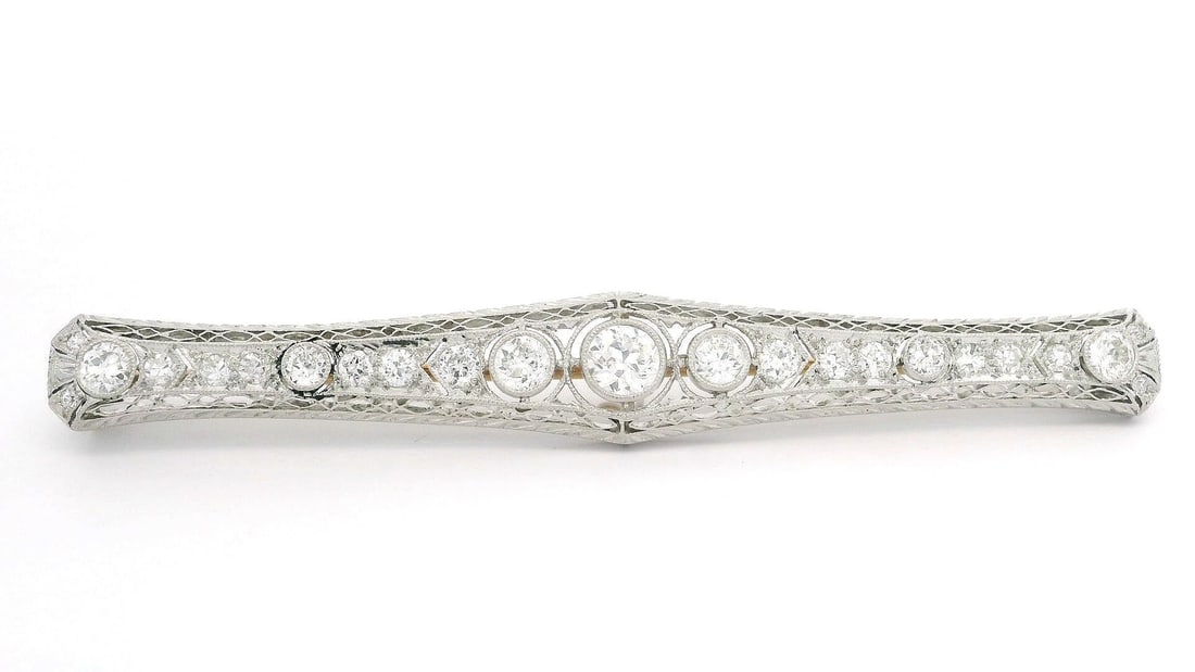 Antique Art Deco Krementz Platinum 14k Gold Diamond Filigree Bar Pin 1.76ctw: Antique Art Deco Krementz Platinum 14k Gold Diamond Filigree Bar Pin 1.76ctw This exquisite Antique Art Deco bar pin showcases a stunning blend of craftsmanship and elegance. Created by Krementz, this