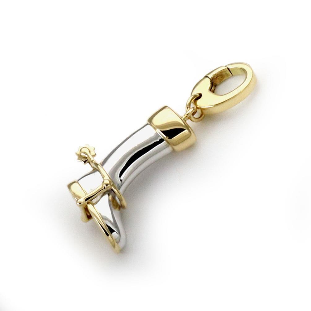 Gucci 18k Gold Cowboy Boot Pendant with Clip Bail: Gucci 18k Gold Cowboy Boot Pendant with Clip Bail This exquisite pendant from Gucci is a stunning representation of craftsmanship, featuring a cowboy long boot design complete with a spur. Made from a