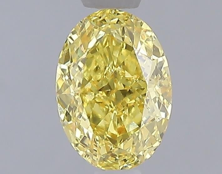 Loose Diamond - OVAL 1.09ct Fancy Vivid Yellow VS2: Loose Diamond - OVAL 1.09ct Fancy Vivid Yellow VS2 Source: This is a real non-mined Diamond that has been grown in a lab Shape: OVAL Carats: 1.09 Color: Fancy Vivid Yellow Certification: IGI Video: