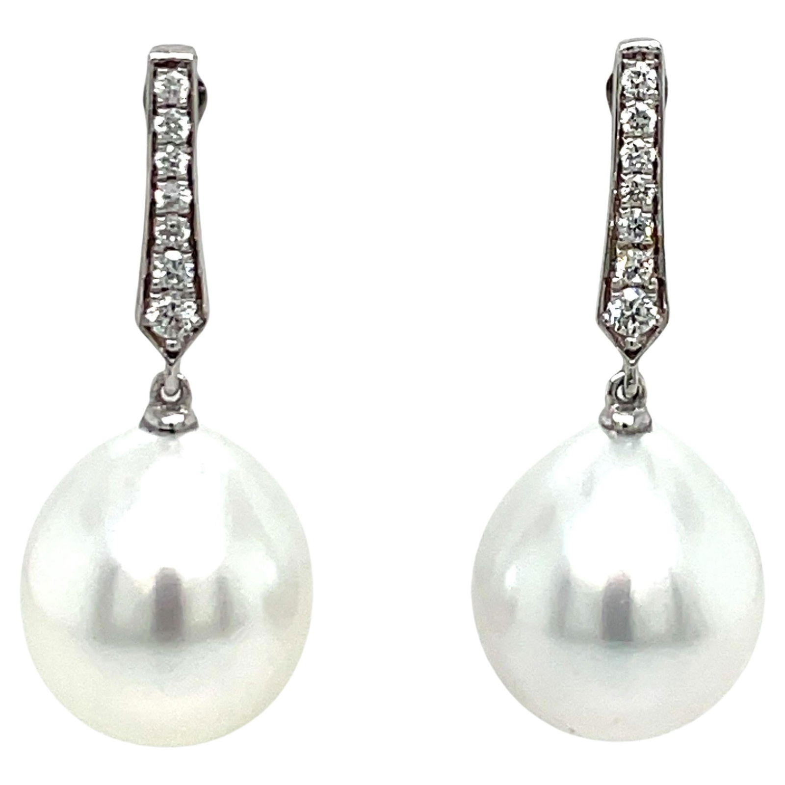 Harbor Diamonds 18K White Gold Diamond South Sea Pearl Drop Earrings: Harbor Diamonds 18K White Gold Diamond South Sea Pearl Drop Earrings Elevate your elegance with these stunning 18 Karat White Gold Diamond South Sea Drop Earrings. These contemporary earrings feature