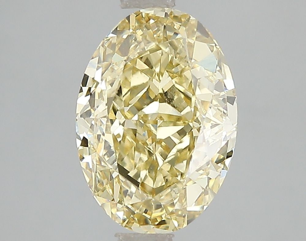 Loose Diamond - OVAL 3.05ct Fancy Intense Yellow VS1: Loose Diamond - OVAL 3.05ct Fancy Intense Yellow VS1 Source: This is a real non-mined Diamond that has been grown in a lab Shape: OVAL Carats: 3.05 Color: Fancy Intense Yellow Certification: IGI Video