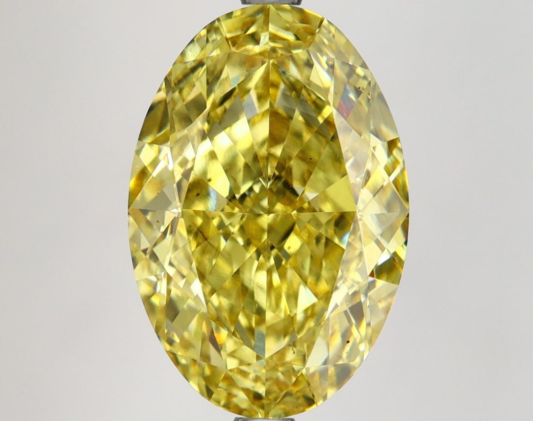Loose Diamond - OVAL 7.1ct Fancy Vivid Yellow VS2: Loose Diamond - OVAL 7.1ct Fancy Vivid Yellow VS2 Source: This is a real non-mined Diamond that has been grown in a lab Shape: OVAL Carats: 7.1 Color: Fancy Vivid Yellow Certification: IGI Video: