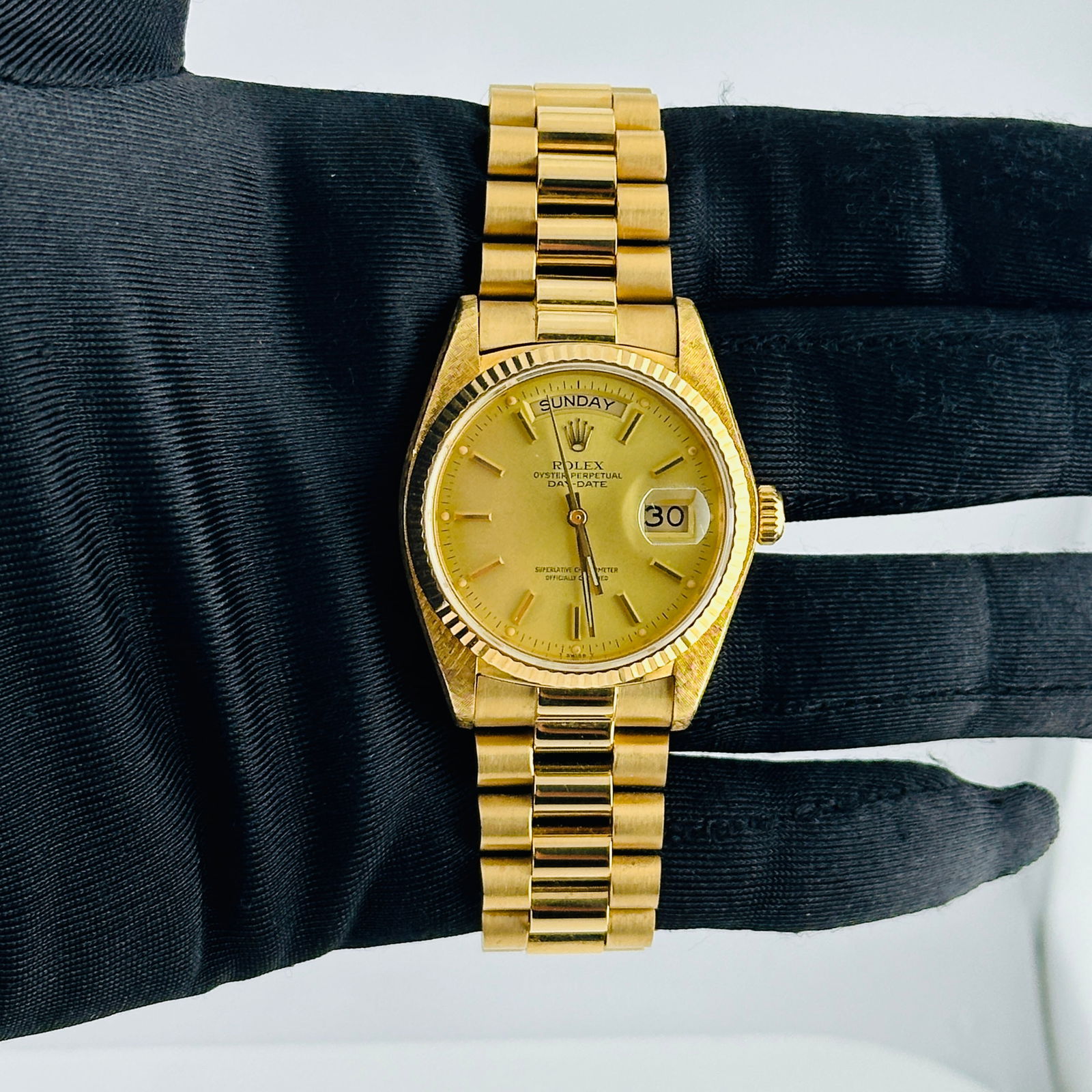 Champagne Stick Dial Day-Date Ref 18038 with Aftermarket President Bracelet: Champagne Stick Dial Day-Date Ref 18038 with Aftermarket President Bracelet This men's Rolex Day-Date features a champagne stick dial and a fluted bezel, complemented by an aftermarket President-style