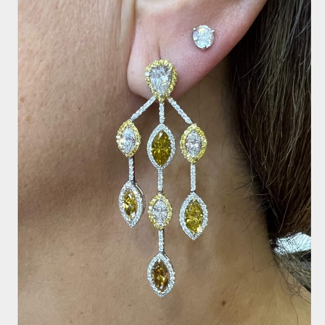 18K White Gold Natural Color Diamond Earrings 16 Diamonds 2.5 Inch: 18K White Gold Natural Color Diamond Earrings 16 Diamonds 2.5 Inch These stunning earrings are crafted from 18K white gold and feature a brilliant arrangement of natural color diamonds. The earrings w