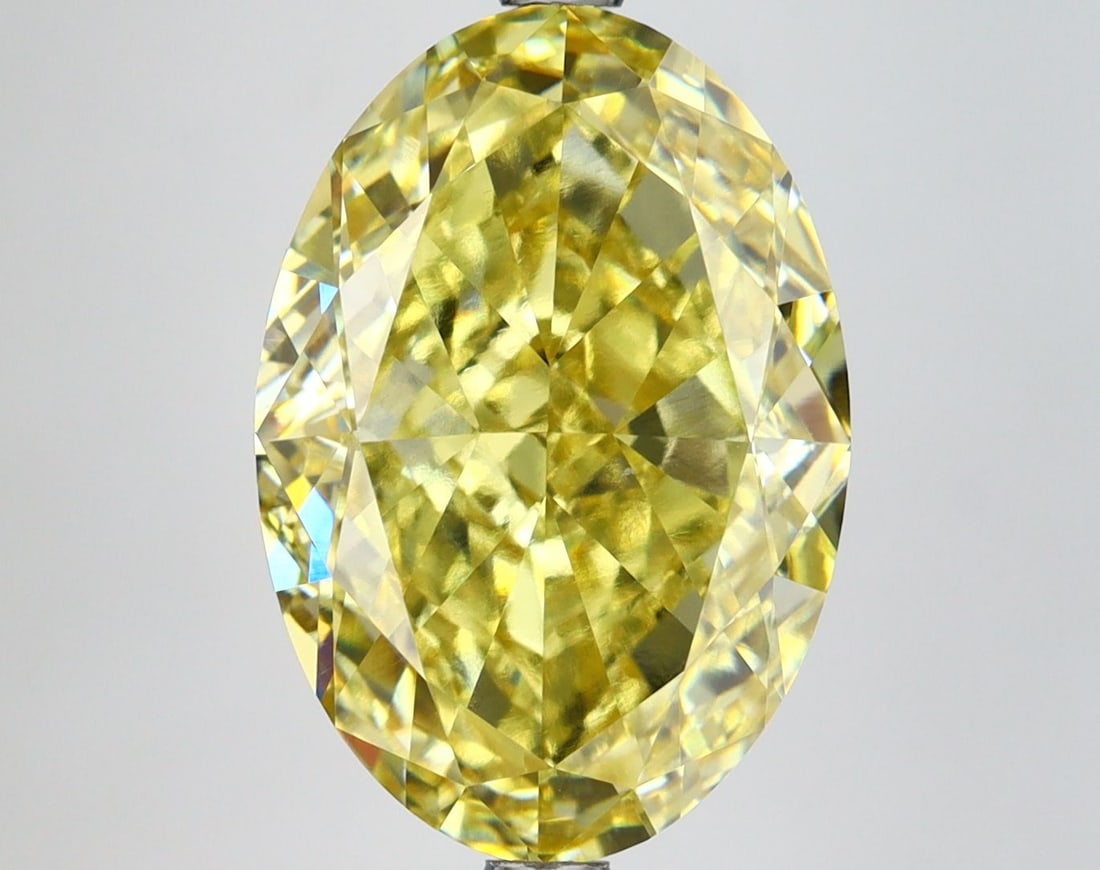 Loose Diamond - OVAL 7.12ct Fancy Vivid Yellow VVS2: Loose Diamond - OVAL 7.12ct Fancy Vivid Yellow VVS2 Source: This is a real non-mined Diamond that has been grown in a lab Shape: OVAL Carats: 7.12 Color: Fancy Vivid Yellow Certification: IGI Video:
