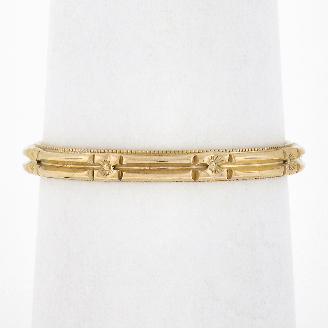 Antique 14k Yellow Gold Floral Engraved Eternity Stack Band Ring: Antique 14k Yellow Gold Floral Engraved Eternity Stack Band Ring This exquisite antique eternity stack band ring is crafted from solid 14k yellow gold, featuring detailed engraved floral work that emb