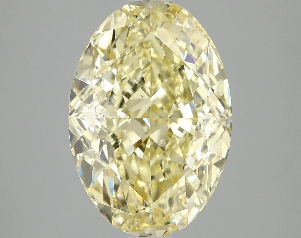 Loose Diamond - OVAL 4.1ct Fancy Vivid Yellow VS1: Loose Diamond - OVAL 4.1ct Fancy Vivid Yellow VS1 Source: This is a real non-mined Diamond that has been grown in a lab Shape: OVAL Carats: 4.1 Color: Fancy Vivid Yellow Certification: IGI Video: