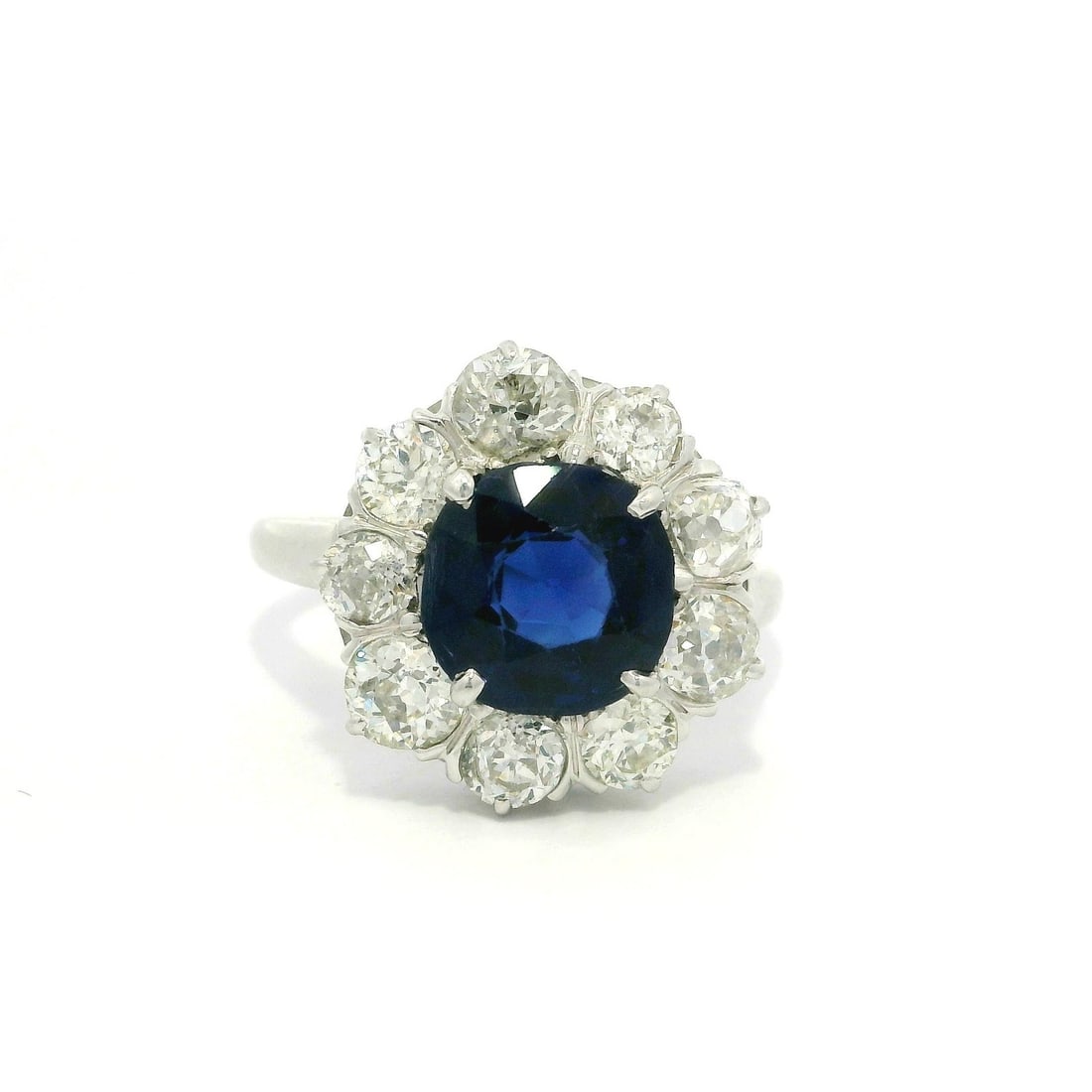 Platinum 3.65ctw AGL No Heat Blue Sapphire Diamond Halo Ring: Platinum 3.65ctw AGL No Heat Blue Sapphire Diamond Halo Ring This exquisite cocktail ring showcases a stunning natural sapphire and diamond halo, crafted in solid platinum. At its center, a remarkable