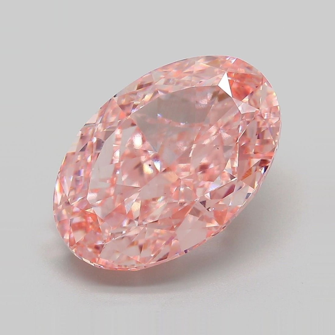 Loose Diamond - OVAL 8.38ct Fancy Vivid Pink VS2: Loose Diamond - OVAL 8.38ct Fancy Vivid Pink VS2 Source: This is a real non-mined Diamond that has been grown in a lab Shape: OVAL Carats: 8.38 Color: Fancy Vivid Pink Certification: IGI Video: