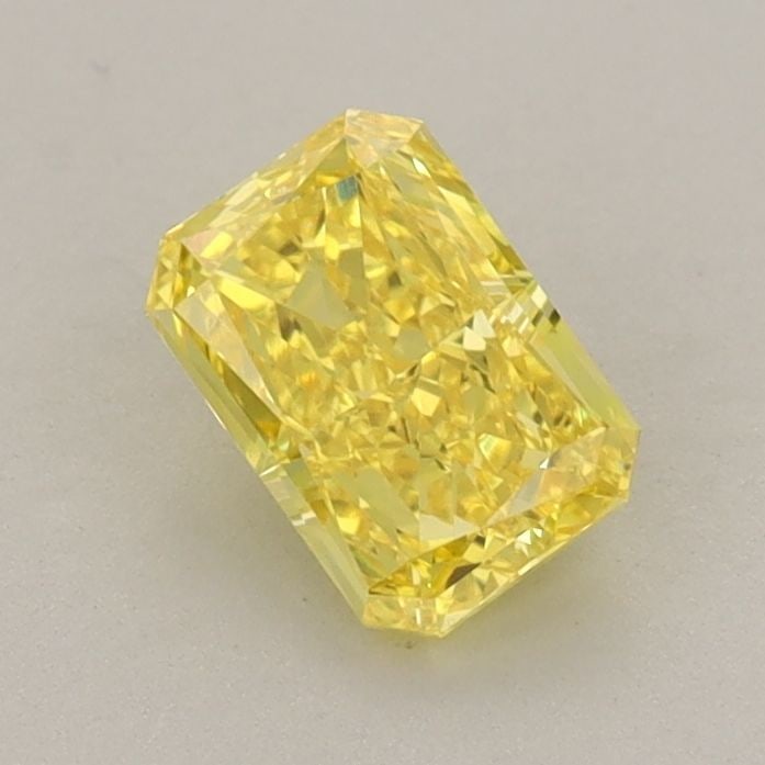 Loose Diamond - RADIANT 0.74ct Fancy Vivid Yellow VS1: Loose Diamond - RADIANT 0.74ct Fancy Vivid Yellow VS1 Source: This is a real non-mined Diamond that has been grown in a lab Shape: RADIANT Carats: 0.74 Color: Fancy Vivid Yellow Certification: IGI Vid