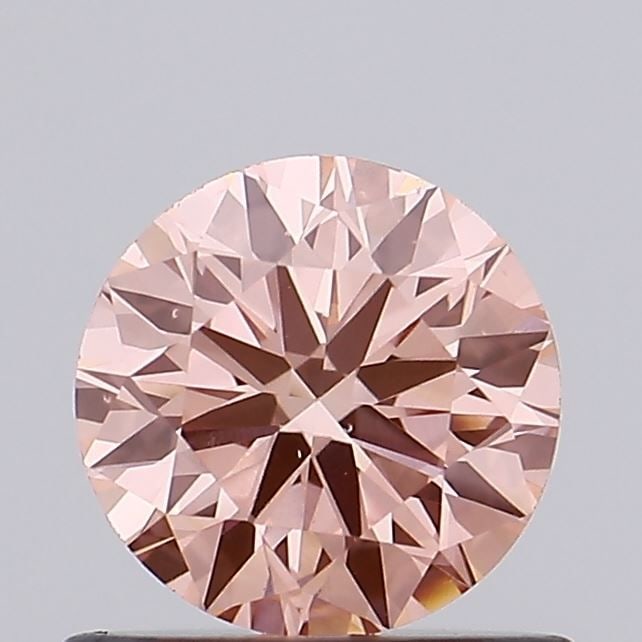 Loose Diamond - ROUND 0.65ct Fancy Vivid Pink VS1: Loose Diamond - ROUND 0.65ct Fancy Vivid Pink VS1 Source: This is a real non-mined Diamond that has been grown in a lab Shape: ROUND Carats: 0.65 Color: Fancy Vivid Pink Certification: IGI Video: