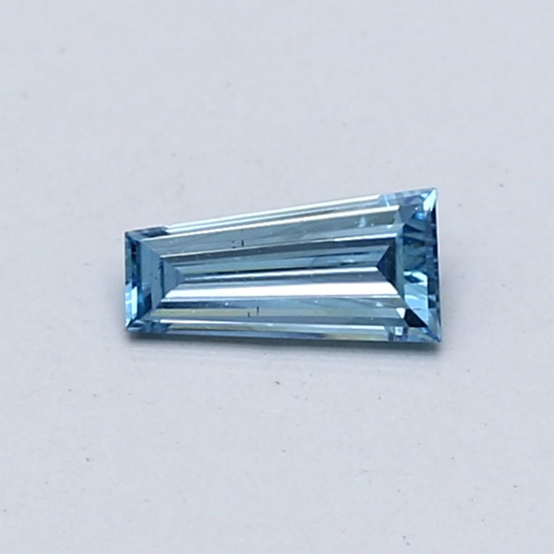 Loose Diamond - TAPERED BAGUETTE 0.21ct Fancy Intense Blue VS2: Loose Diamond - TAPERED BAGUETTE 0.21ct Fancy Intense Blue VS2 Source: This is a real non-mined Diamond that has been grown in a lab Shape: TAPERED BAGUETTE Carats: 0.21 Color: Fancy Intense Blue Cert