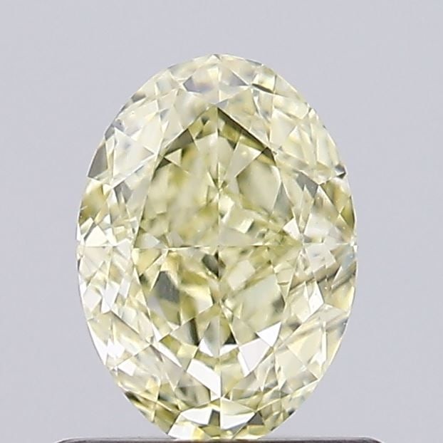 Loose Diamond - OVAL 0.67ct Fancy Yellow VS1: Loose Diamond - OVAL 0.67ct Fancy Yellow VS1 Source: This is a real non-mined Diamond that has been grown in a lab Shape: OVAL Carats: 0.67 Color: Fancy Yellow Certification: IGI Video: